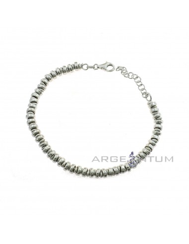 White gold plated bracelet with smooth and striped washers in 925 silver