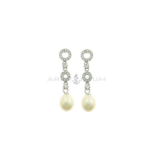 Pendant earrings with round shapes degradè white zircon alternating with points of light and oval pearl plated white gold in 925