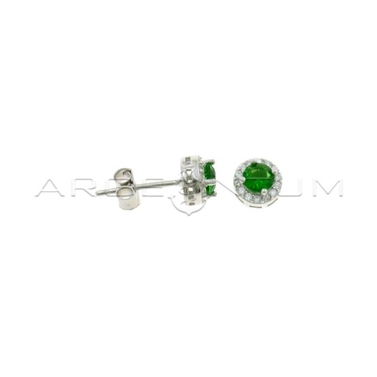 Lobe earrings ø 6 mm with central round green zircon in a frame of white zircons plated white gold in 925 silver