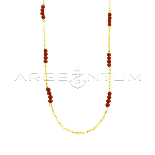 Diamond-coated rolò link necklace with red coral paste spheres plated with yellow gold in 925 silver