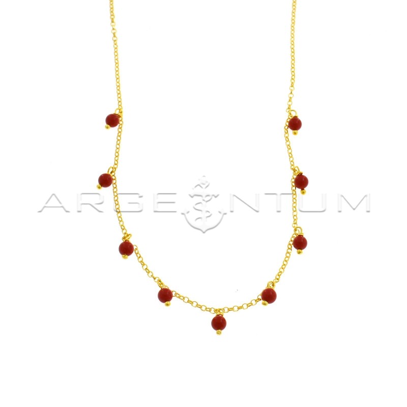 Diamond-coated rolo link necklace with pendant spheres in yellow gold plated coral paste in 925 silver