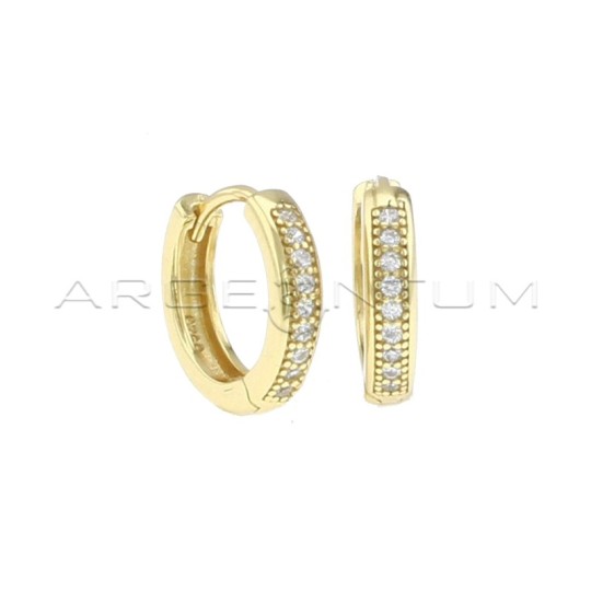 White semi-zircon hoop earrings with yellow gold plated snap clasp in 925 silver