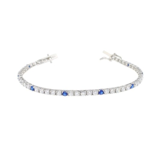 White gold plated tennis bracelet with 5 white and 1 blue 3mm zircons. in 925 silver